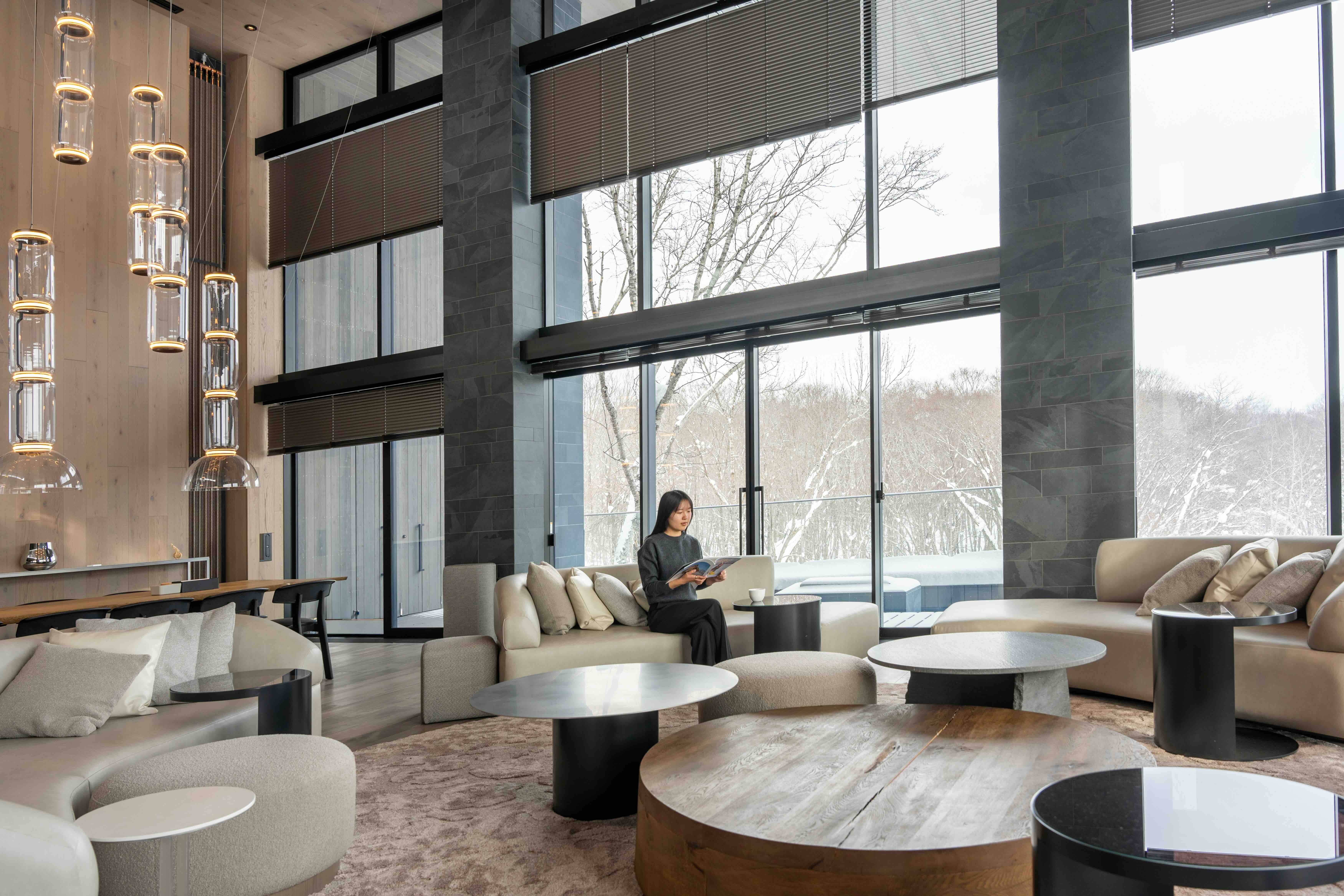 Corniche Chalet Niseko Living Area Woman Reading Magazine 1 1