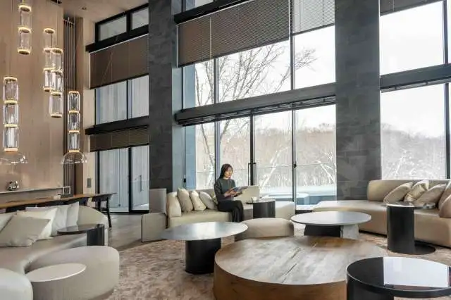 Corniche Chalet Niseko Living Area Woman Reading Magazine 1 1