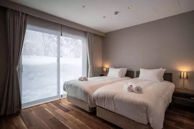 A bedroom with twin beds in Jade Rabbit, a 5 Bedroom Chalet in Niseko