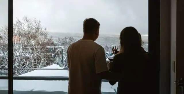 Family admiring the snowy landscape in the Sekka Sekka chalet